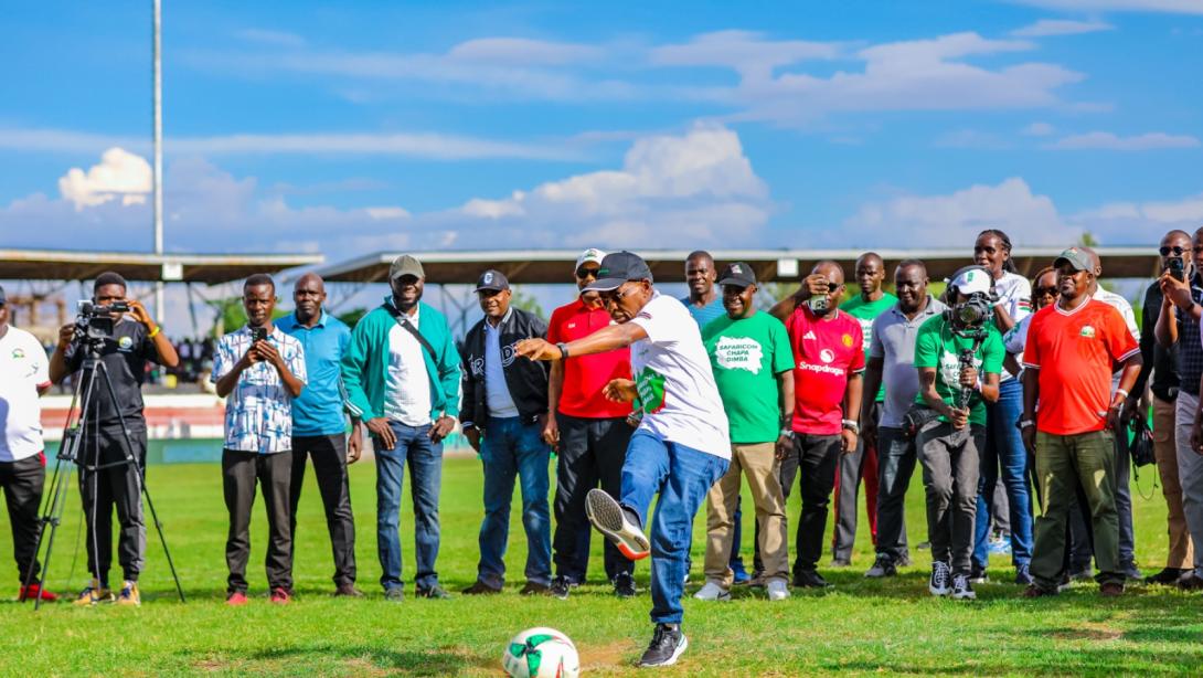 Safaricom CEO Peter Ndegwa takes a penalty kick to officially launch Season Five of the Safaricom Chapa Dimba tournament at Jomo Kenyatta Stadium, Mamboleo, in Kisumu.