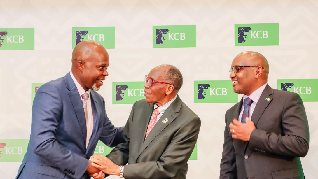 From Left: KCB Group Finance Director, Lawrence Kimathi, Group Chairman, Dr. Joseph Kinyua and Group CEO, Paul Russo share a light moment during a past event.