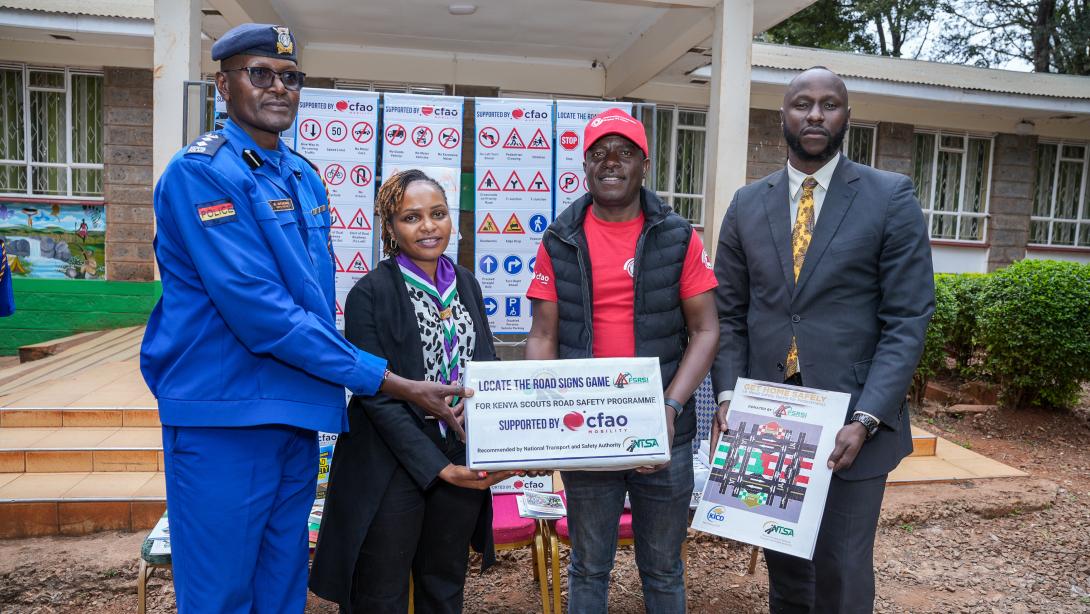 From left: Stella Kibocha, NTSA; Elvis Ikatwa, Upper Hill School teacher; Toyota Kenya Academy CSR Manager Moses Wanami; PC Hassan Adan; and Inspector Maingi Muteti during the handover of road safety learning materials to teachers at the Kenya Scouts Association.