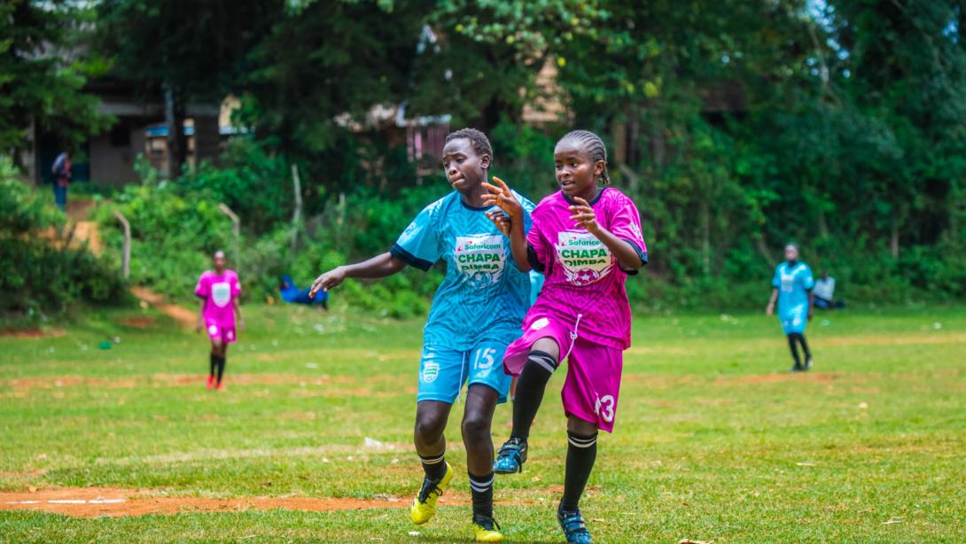 Royal Queens Academy from Embu (purple) in action against Syomunyu Queens from Kitui (blue) during the Season Five of the Safaricom Chapa Dimba Eastern Region Playoffs at Kairuri Grounds in Embu.