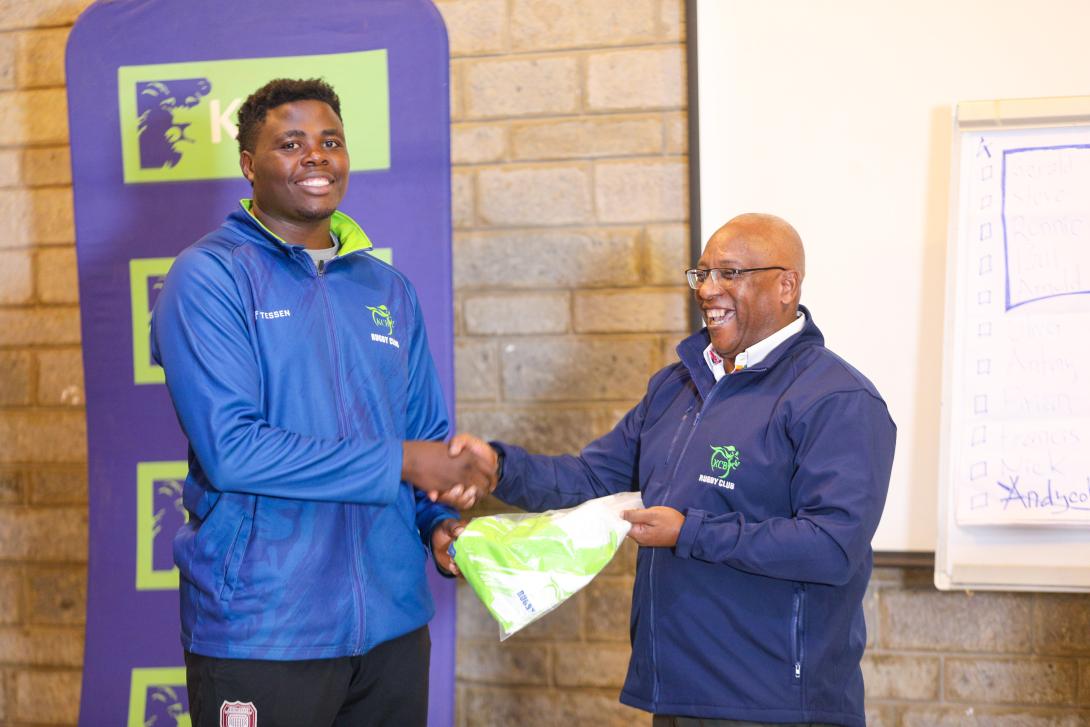 KCB Rugby Club Chairman James Mugo gifts Andy Cole Omolo ahead of his move to Japan during his farewell party at the KCB Sports Club, Ruaraka, on March 26, 2026.