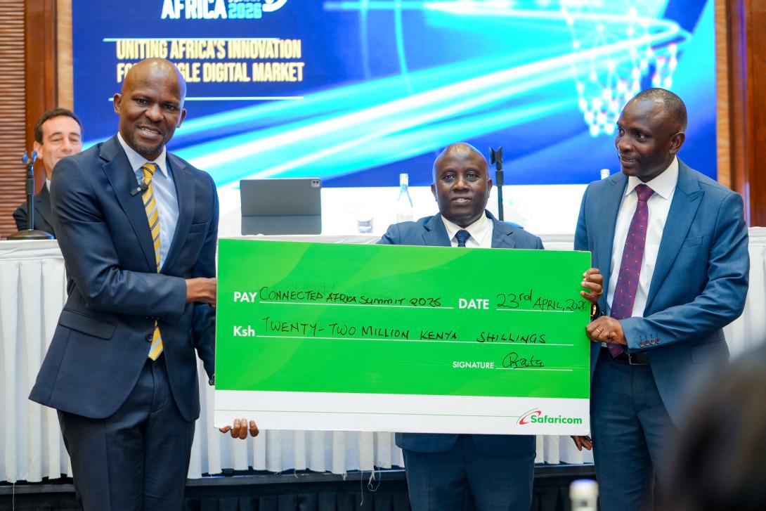 From right: Frankline Okata, Senior Executive, Safaricom PLC; Eng. John Tanui, CBS, Principal Secretary, State Department for ICT and the Digital Economy; and Jessy Kiveu Maruti, Chief Executive Officer, ICT Authority, during the presentation of a KES 22 million cheque at the Connected Africa Summit 2026 Media Briefing.