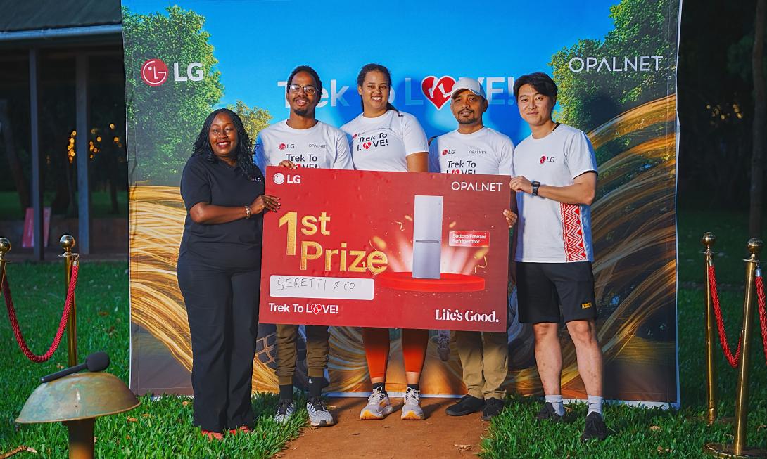 LG East Africa Head of Marketing, Jane Kariuki (L), and Opalnet Business Development Manager, Brijesh Kumar (R), present Sharon Nduati and Nick Nduati, first runners-up of the #TrekToLove challenge, with an LG 55-inch Smart TV. The pair stood out for their coordination and consistency throughout the obstacle course finale at Karura Forest.