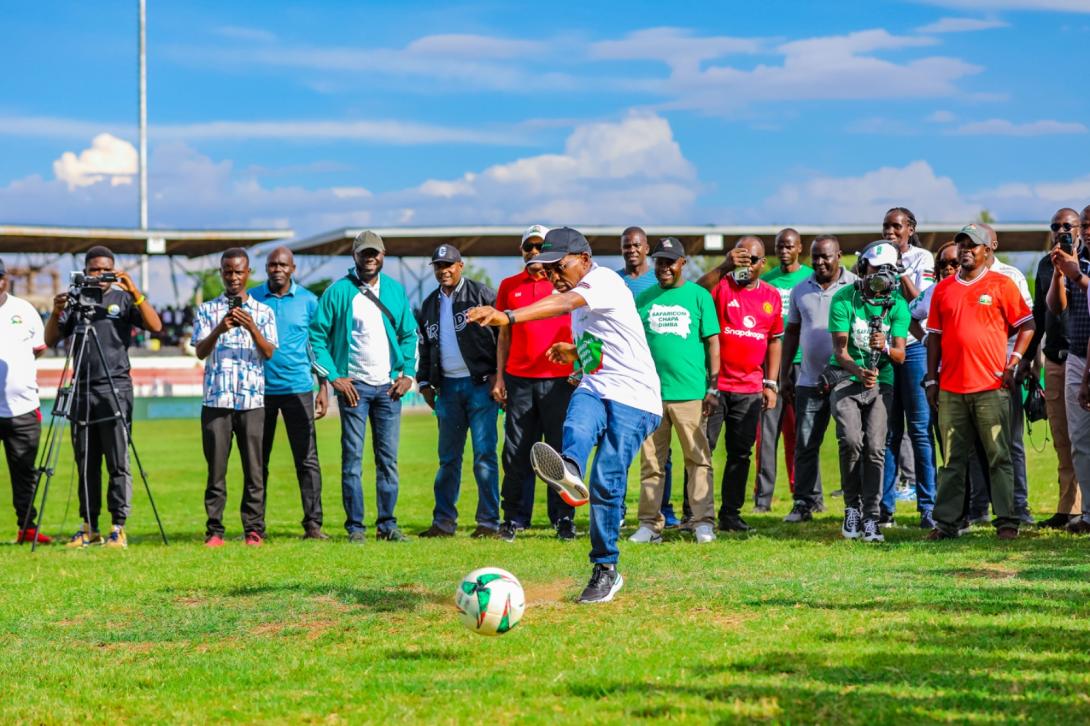 Safaricom CEO Peter Ndegwa takes a penalty kick to officially launch Season Five of the Safaricom Chapa Dimba tournament at Jomo Kenyatta Stadium, Mamboleo, in Kisumu.