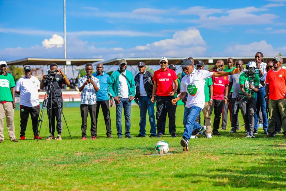 Safaricom CEO Peter Ndegwa takes a penalty kick to officially launch Season Five of the Safaricom Chapa Dimba tournament at Jomo Kenyatta Stadium, Mamboleo, in Kisumu.