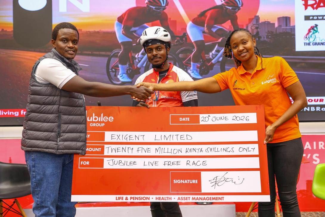 Jubilee Group Marketing and Corporate Communications Manager Peter Kibe with Team Syke Cyclist Bullet Macharia and Grand Nairobi Bike Race Logistics Manager Grace Wambui during the launch of the sixth edition Jubilee Live Free Race. This year's event will be hosted at Uhuru Gardens and will traverse the Southern Bypass route.