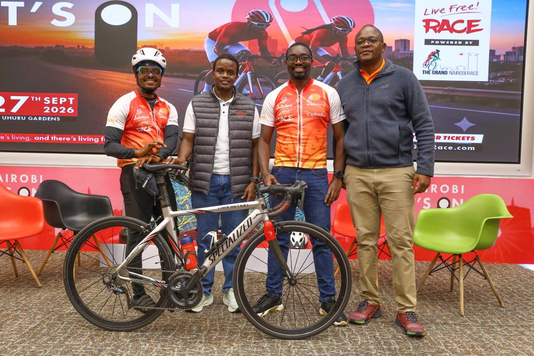 Team Syke Cyclist Bullet Macharia with Jubilee Group Marketing and Corporate Communications Manager Peter Kibe, Head of Strategy Eugene Otieno and Grand Nairobi Bike Race Director Desmond Momanyi during the launch of the sixth edition Jubilee Live Free Race. This year's event will be hosted at Uhuru Gardens and will traverse the Southern Bypass route.